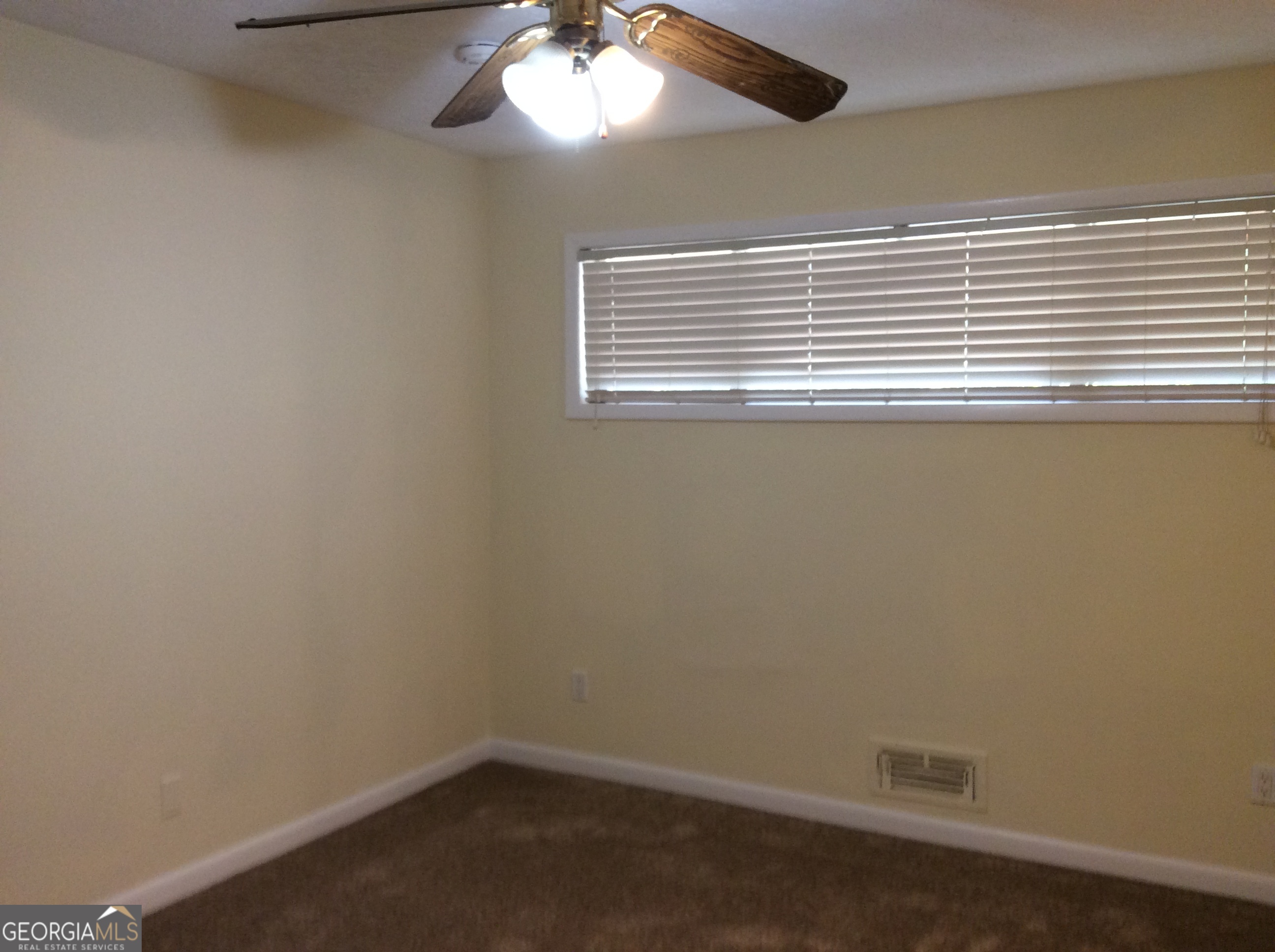 5022 Rock Springs Road Lithonia, GA 30038 - Photo 19 of 35 a view of an empty room with a window