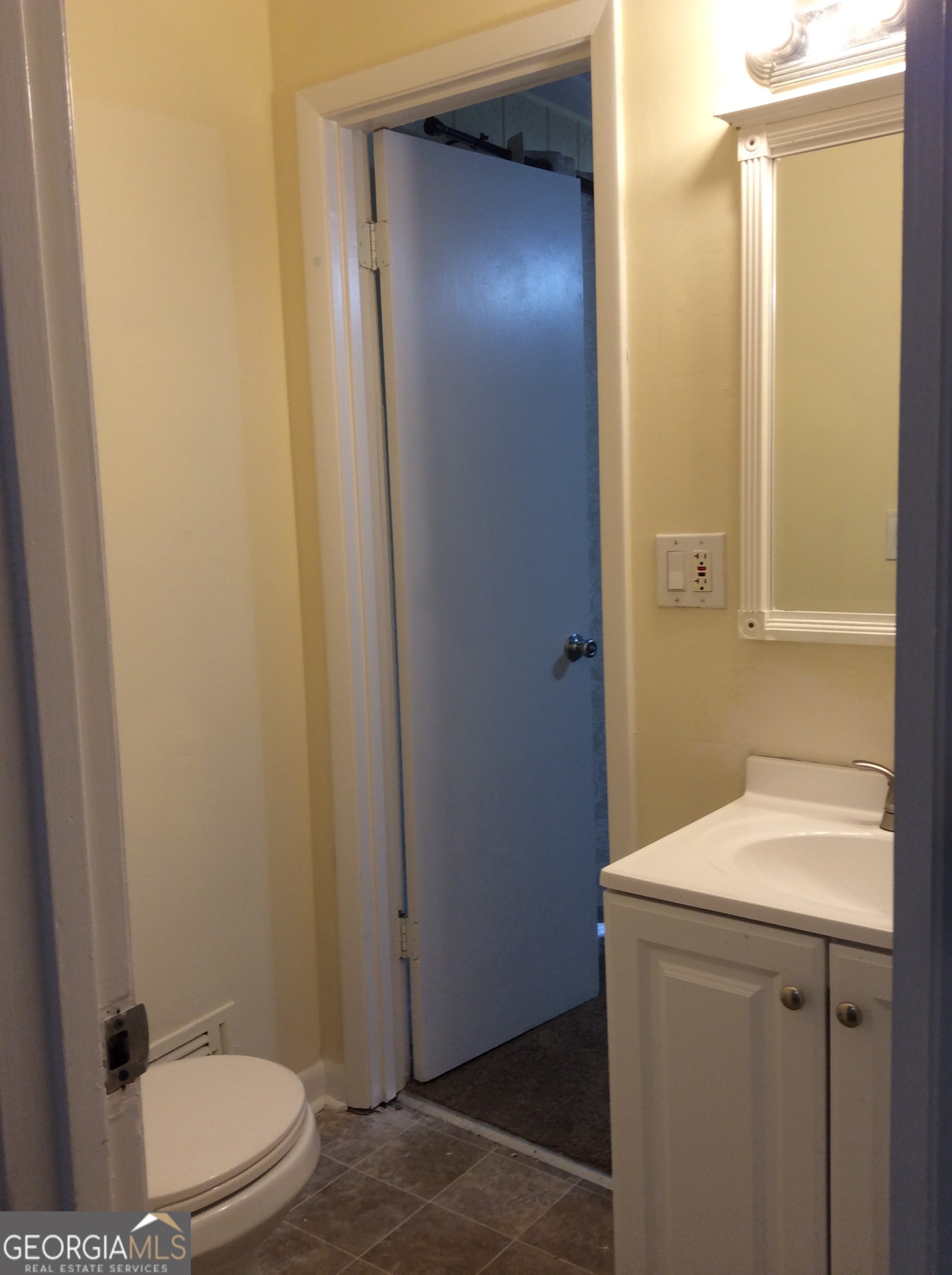 5022 Rock Springs Road Lithonia, GA 30038 - Photo 22 of 35 a bathroom with a sink a toilet and shower