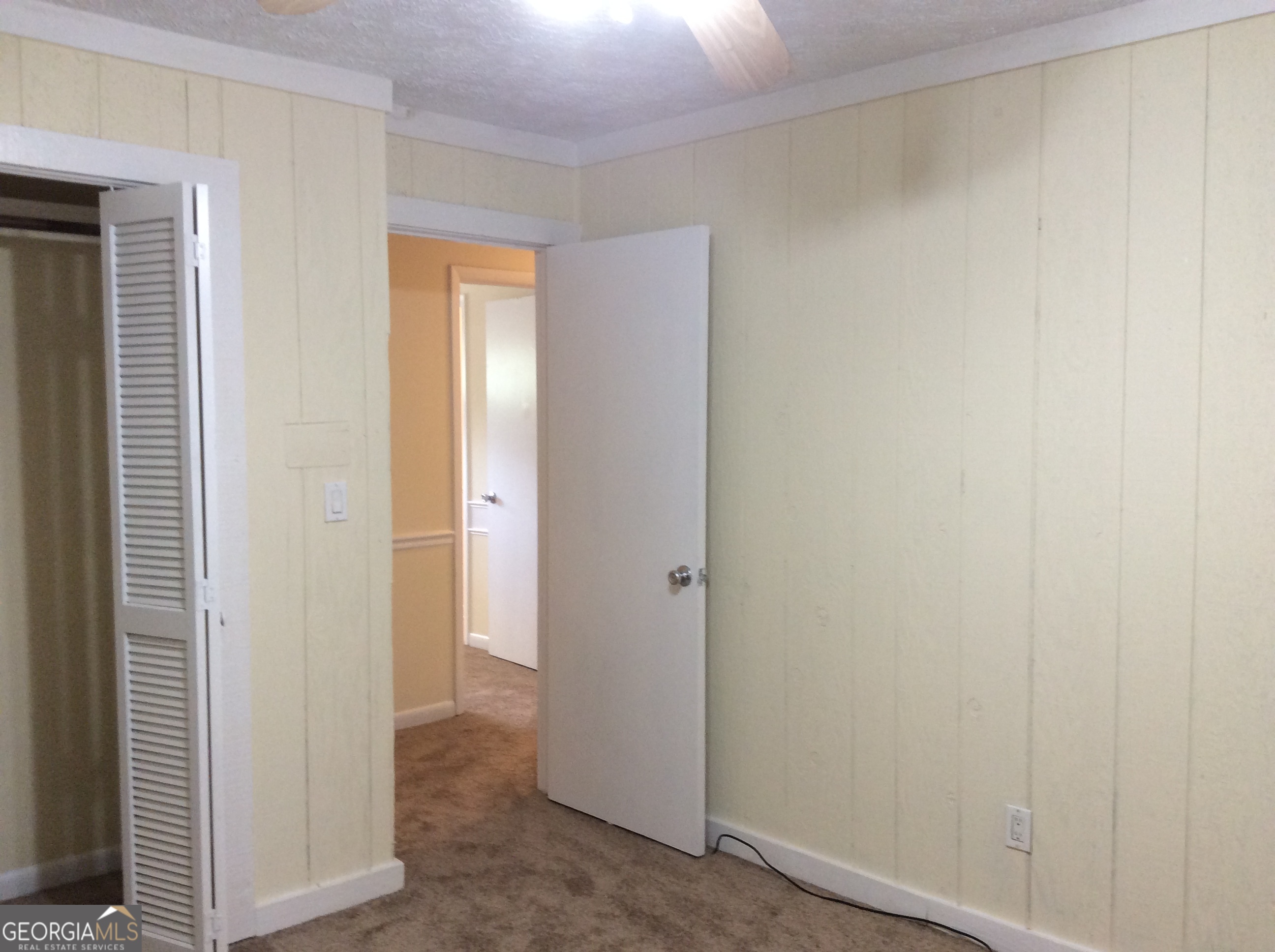 5022 Rock Springs Road Lithonia, GA 30038 - Photo 25 of 35 a view of a room with a wooden door