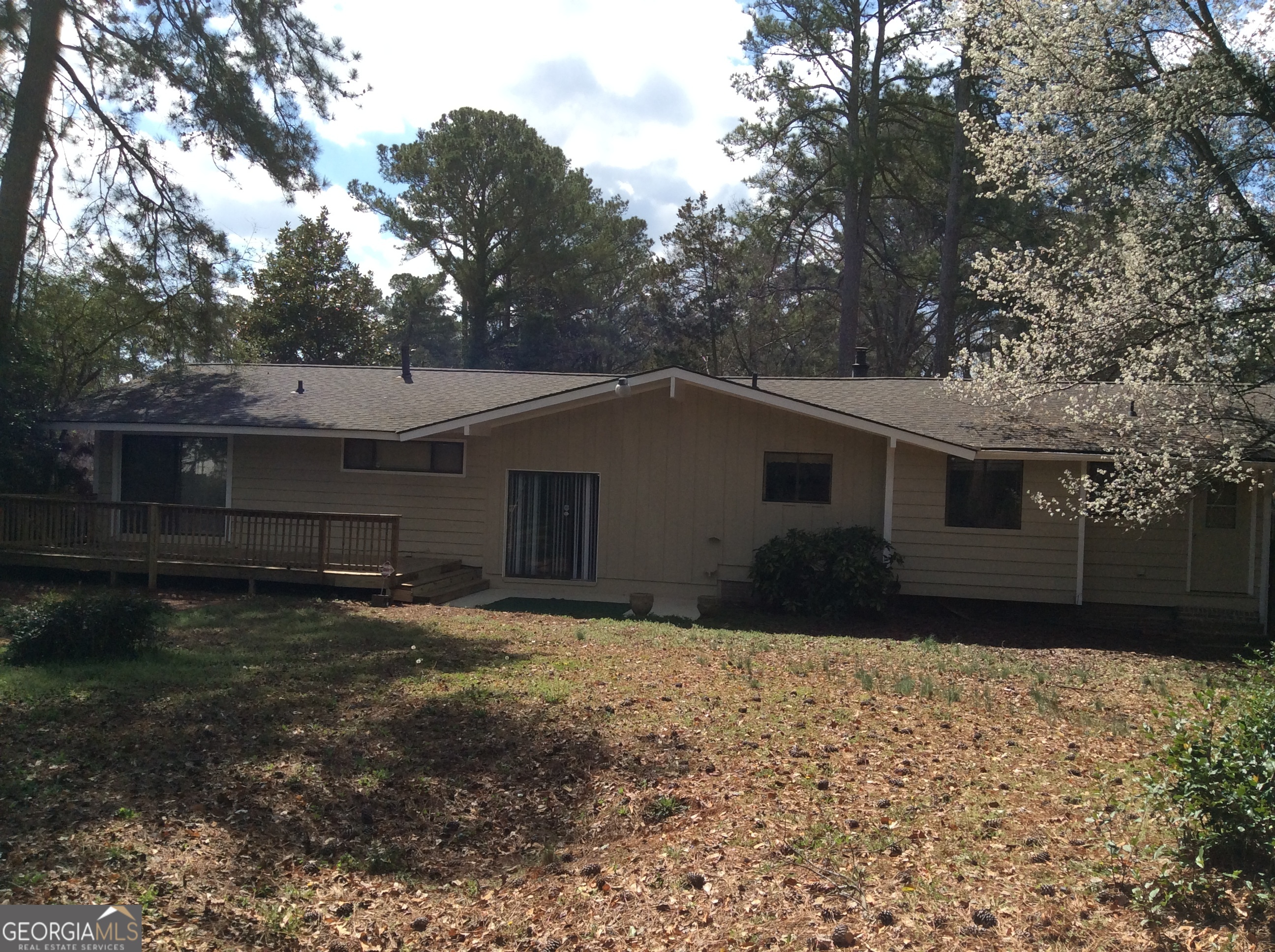 5022 Rock Springs Road Lithonia, GA 30038 - Photo 32 of 35 a view of a house with a yard