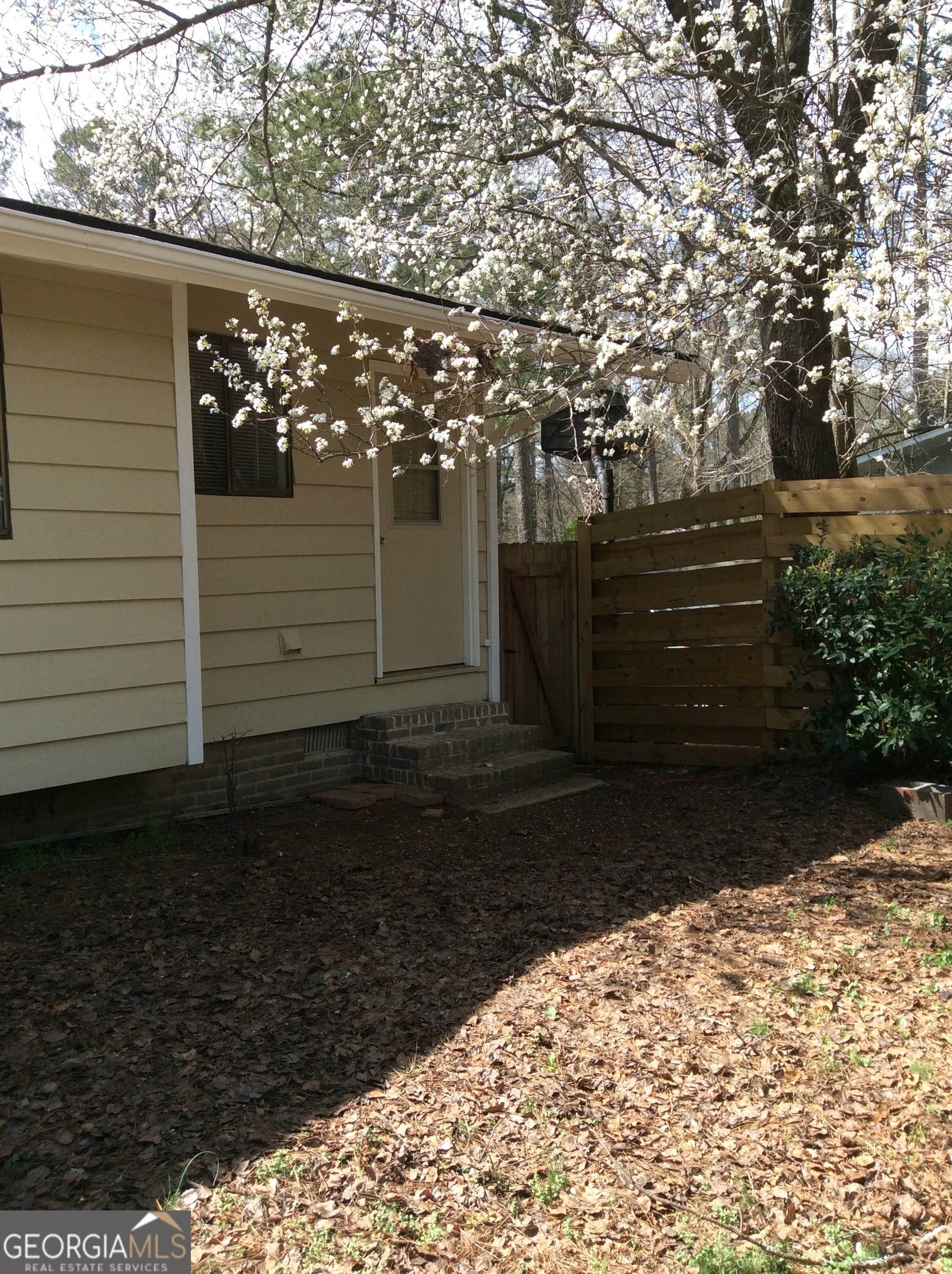 5022 Rock Springs Road Lithonia, GA 30038 - Photo 33 of 35 a view of a backyard of the house