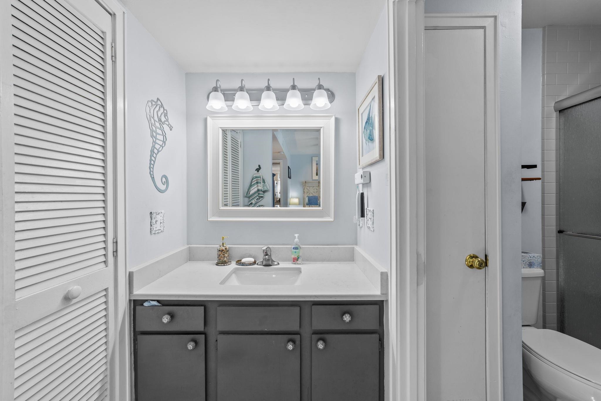 351 Lake Arrowhead Road, Unit 211 Myrtle Beach, SC 29572 - Photo 17 of 40 Bathroom with a closet, vanity, and a shower with shower door