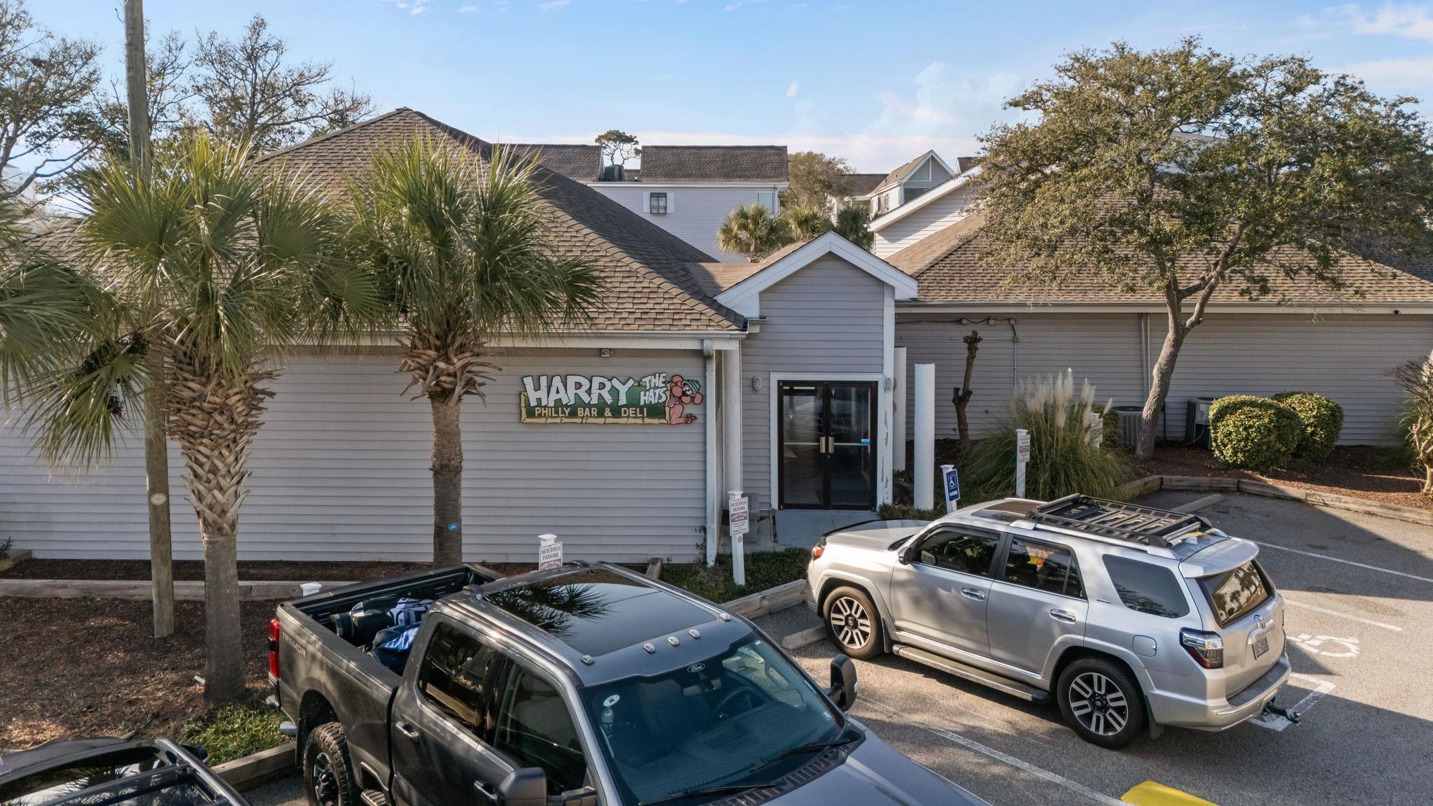 351 Lake Arrowhead Road, Unit 211 Myrtle Beach, SC 29572 - Photo 24 of 40 View of front of home featuring uncovered parking and a shingled roof