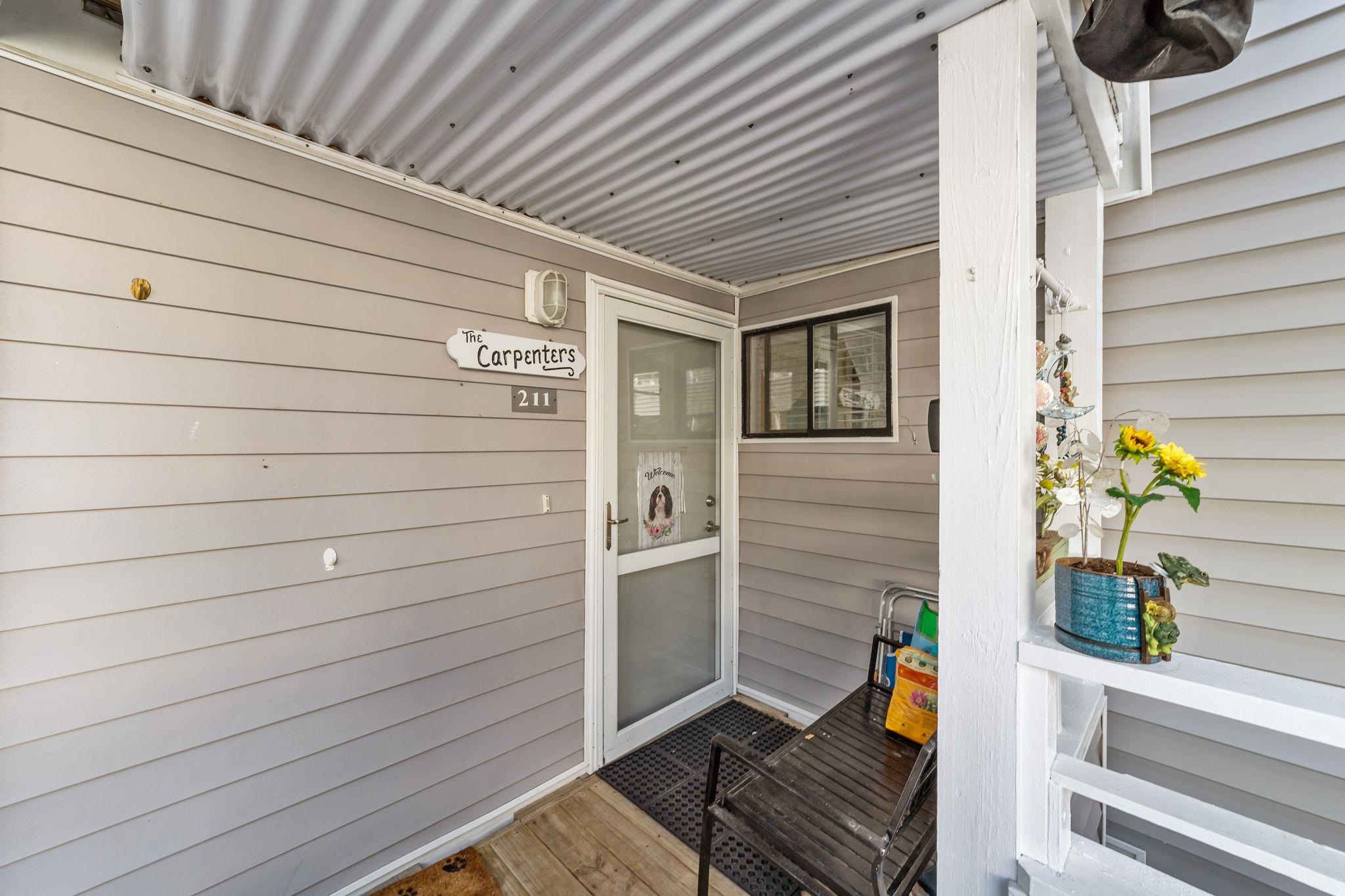 351 Lake Arrowhead Road, Unit 211 Myrtle Beach, SC 29572 - Photo 3 of 40 Doorway to property featuring covered porch