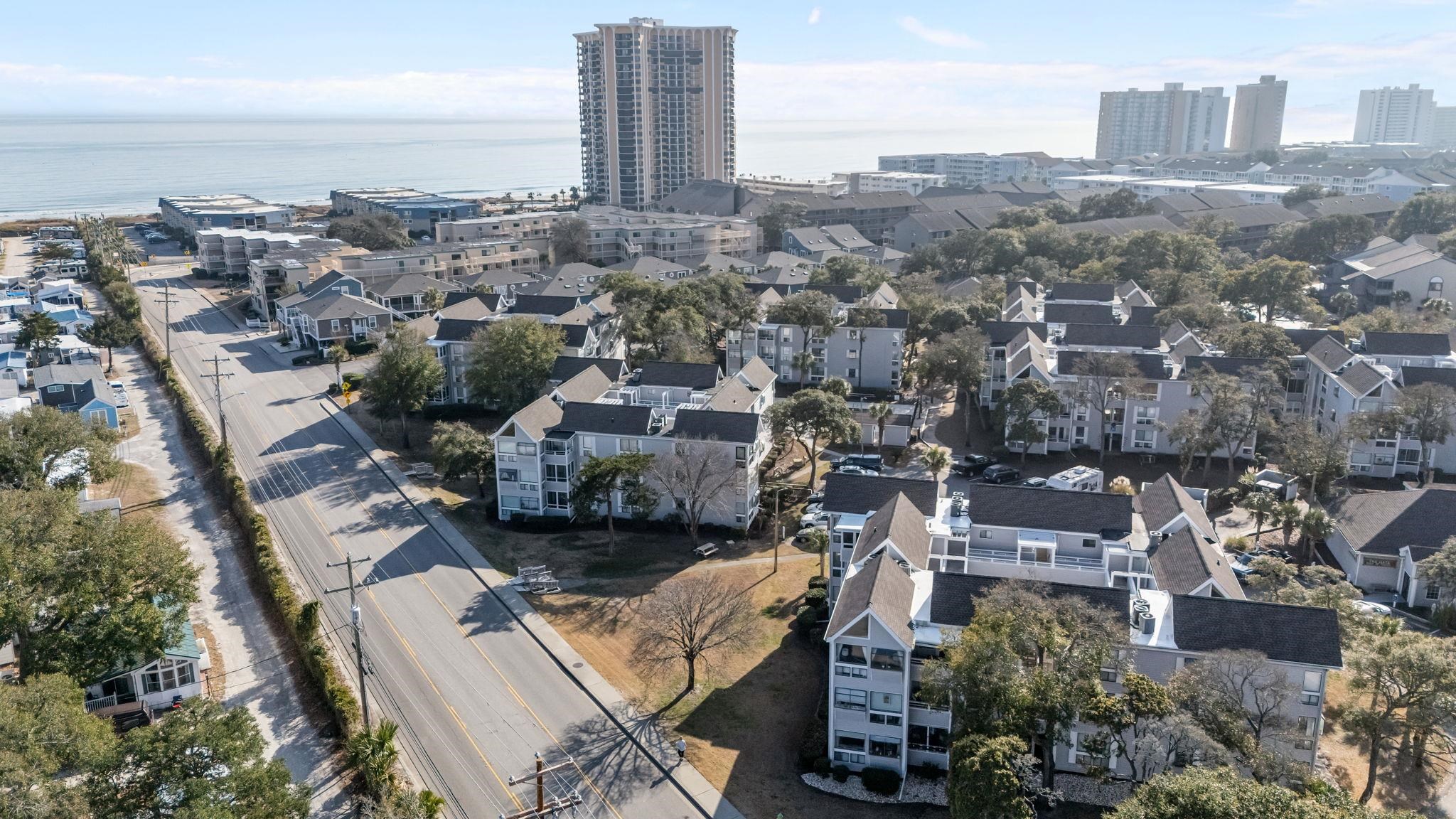 351 Lake Arrowhead Road, Unit 211 Myrtle Beach, SC 29572 - Photo 30 of 40 Aerial view of property's location with a nearby body of water and nearby urban area