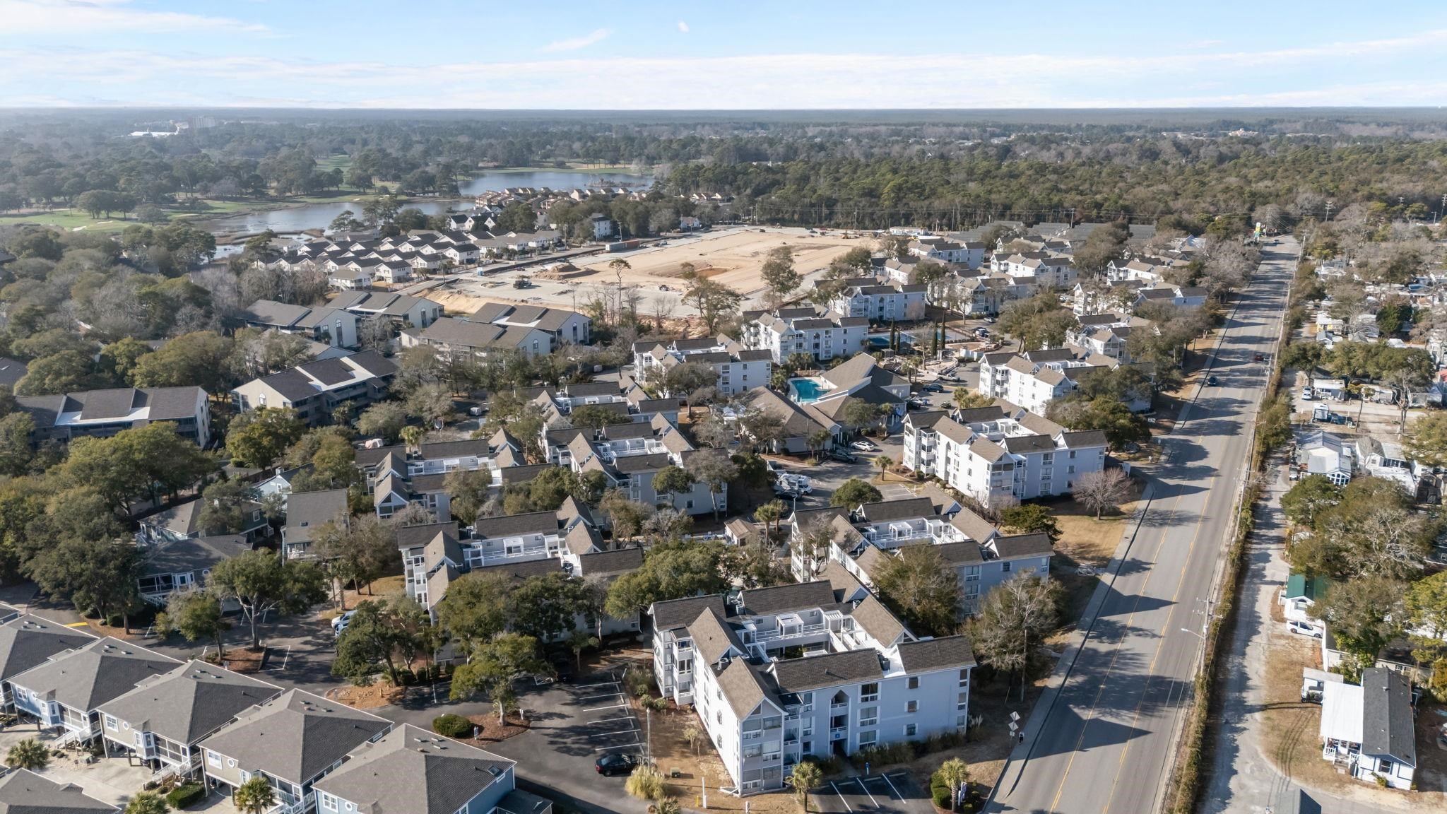 351 Lake Arrowhead Road, Unit 211 Myrtle Beach, SC 29572 - Photo 32 of 40 Aerial overview of property's location with a large body of water and nearby suburban area