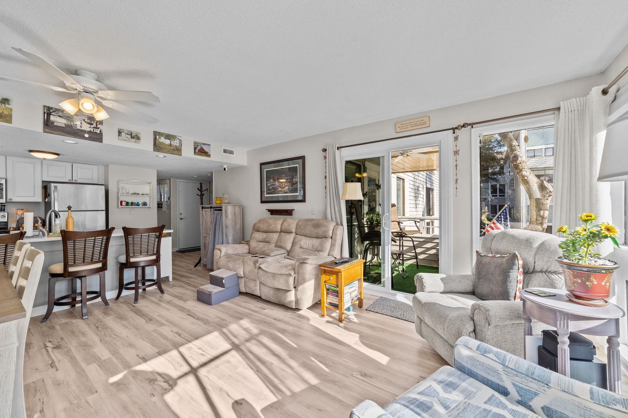 351 Lake Arrowhead Road, Unit 211 Myrtle Beach, SC 29572 - Photo 6 of 40 Living area featuring light wood-style flooring and a ceiling fan