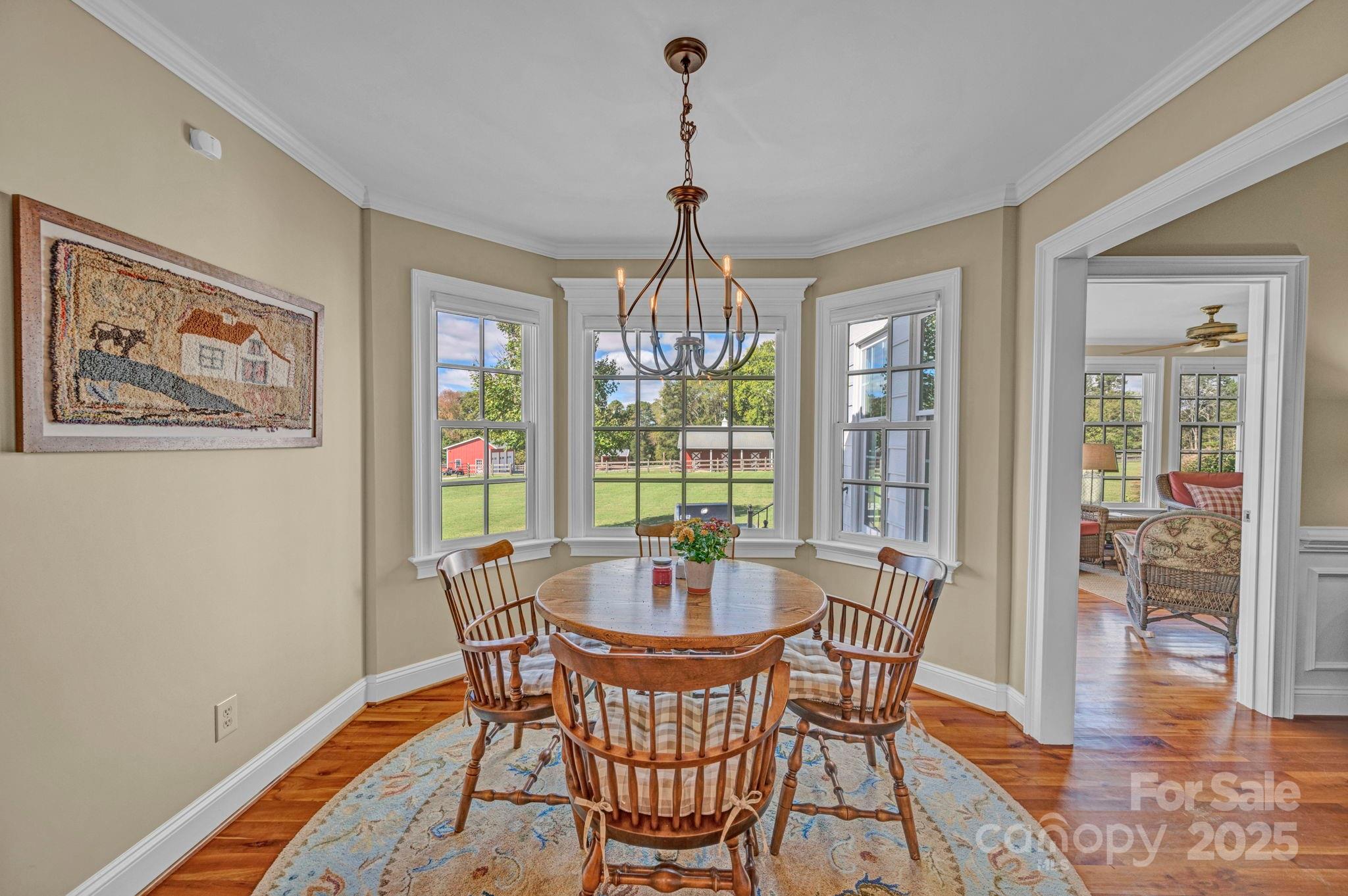 400 Ratledge Road Mocksville, NC 27028 - Photo 13 of 48 a dining room with furniture wooden floor and a chandelier