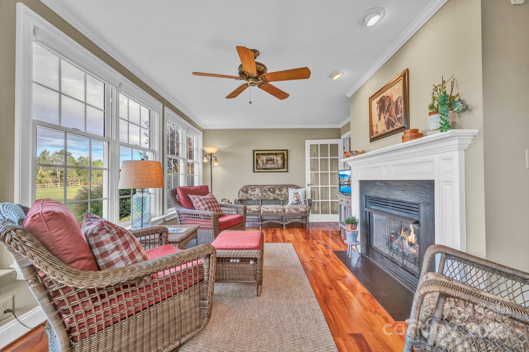 400 Ratledge Road Mocksville, NC 27028 - Photo 14 of 48 a living room with furniture a fireplace and a large window