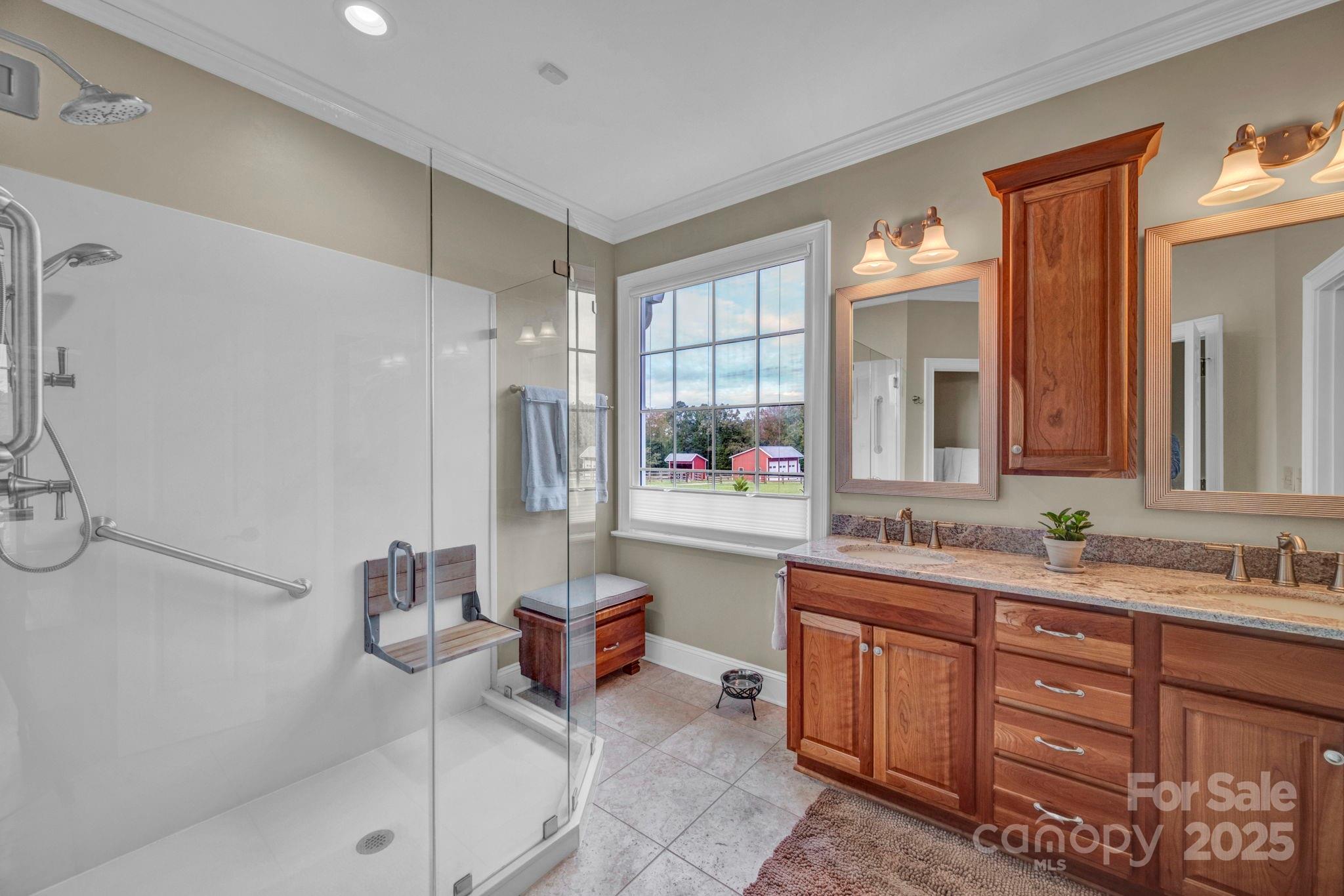400 Ratledge Road Mocksville, NC 27028 - Photo 17 of 48 a spacious bathroom with a double vanity sink toilet mirror and bathtub