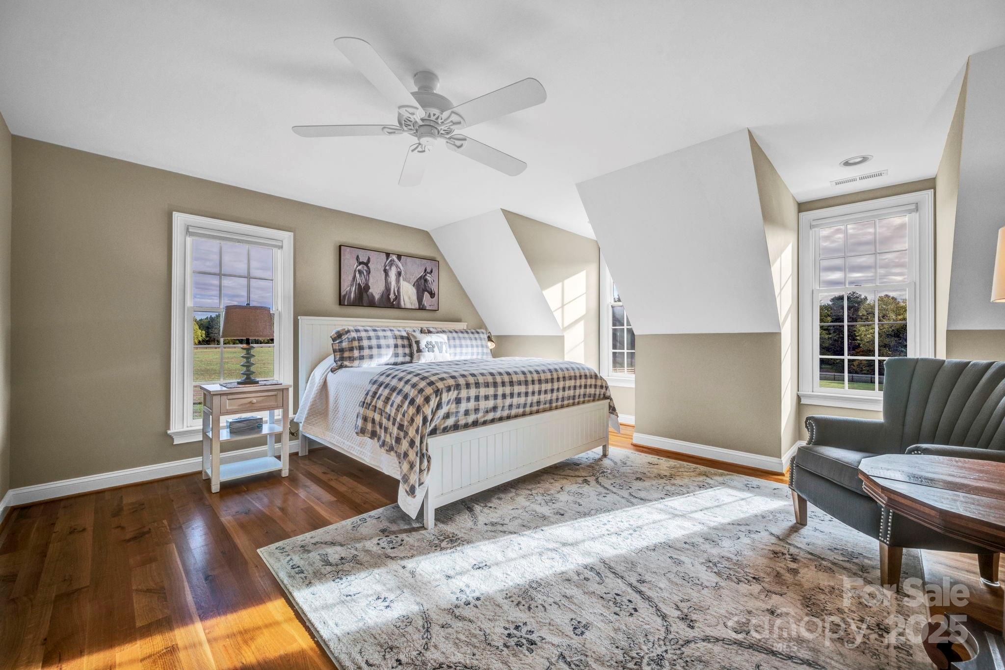 400 Ratledge Road Mocksville, NC 27028 - Photo 22 of 48 a bedroom with a bed couch and a window