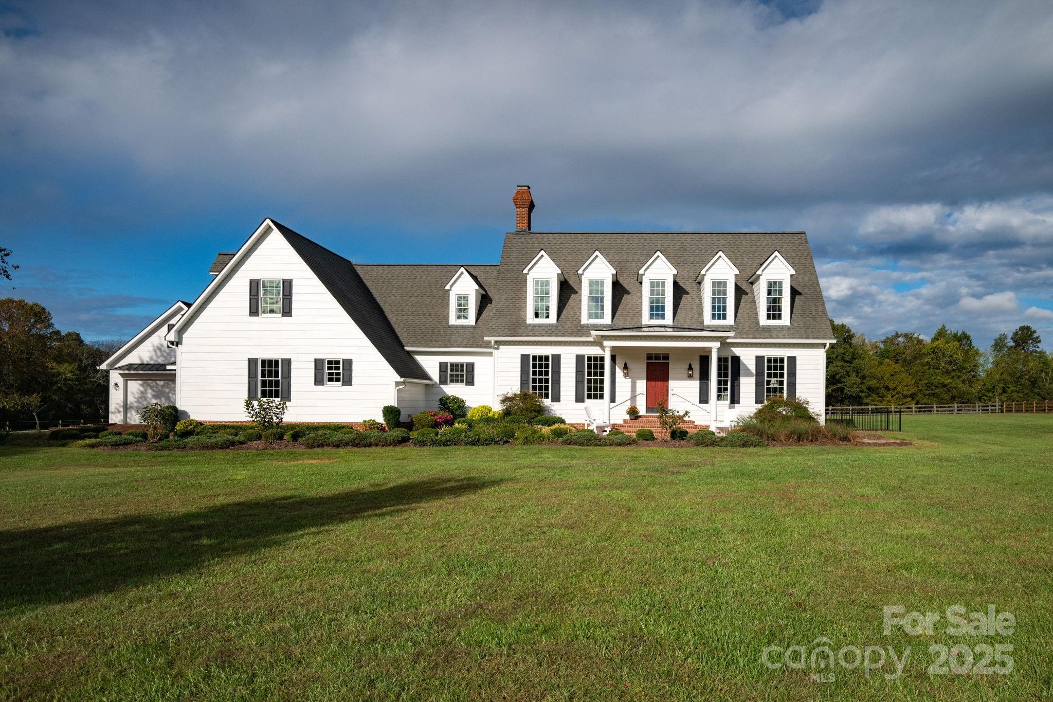 400 Ratledge Road Mocksville, NC 27028 - Photo 5 of 48 a front view of a house with a garden