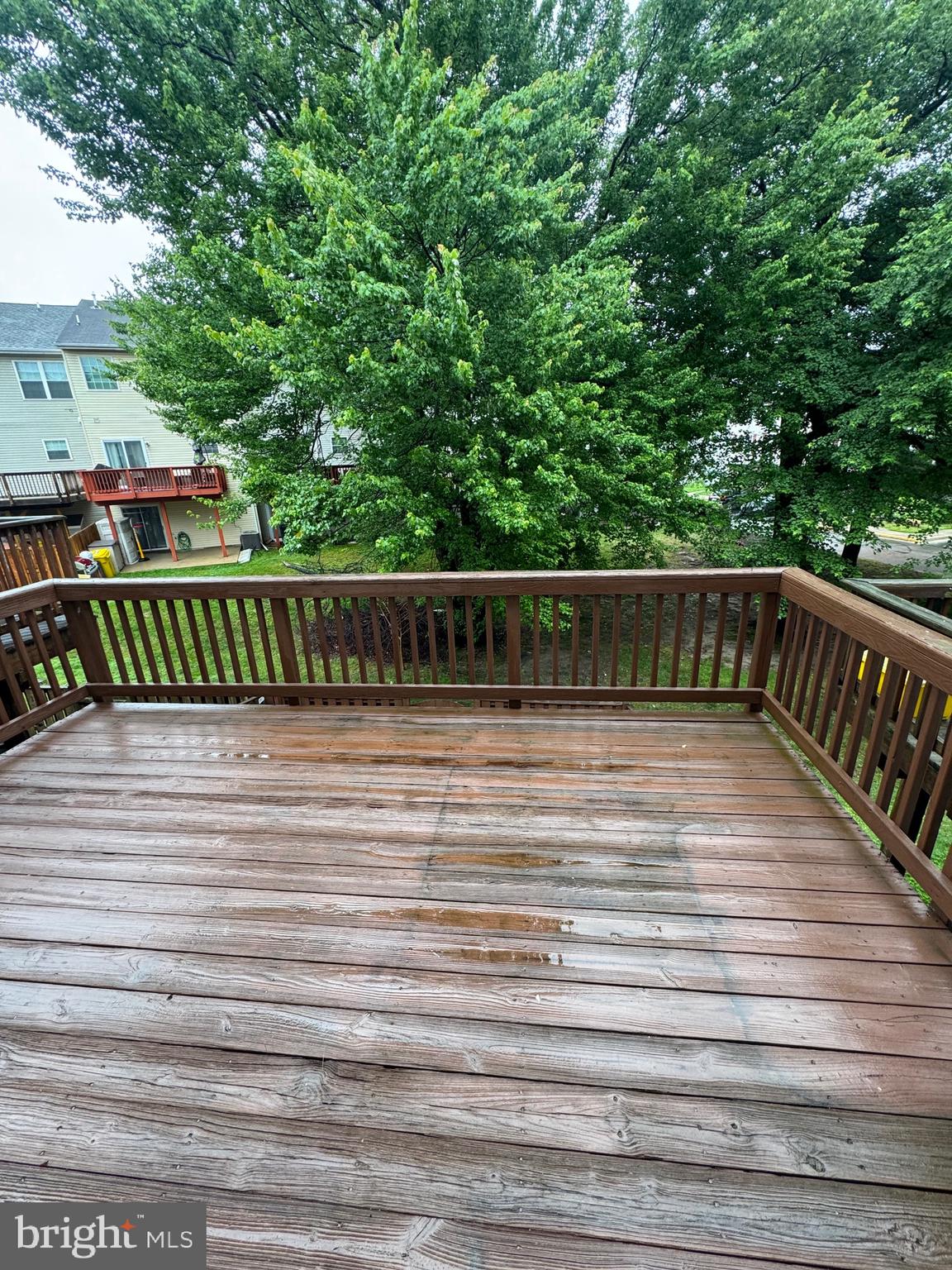 7705 Periwinkle Way, Unit 71 Severn, MD 21144 - Photo 28 of 28 a view of balcony with wooden floor