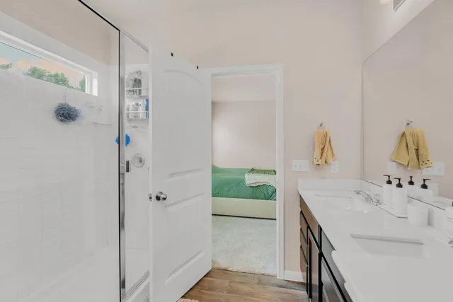 a bathroom with a sink and mirror