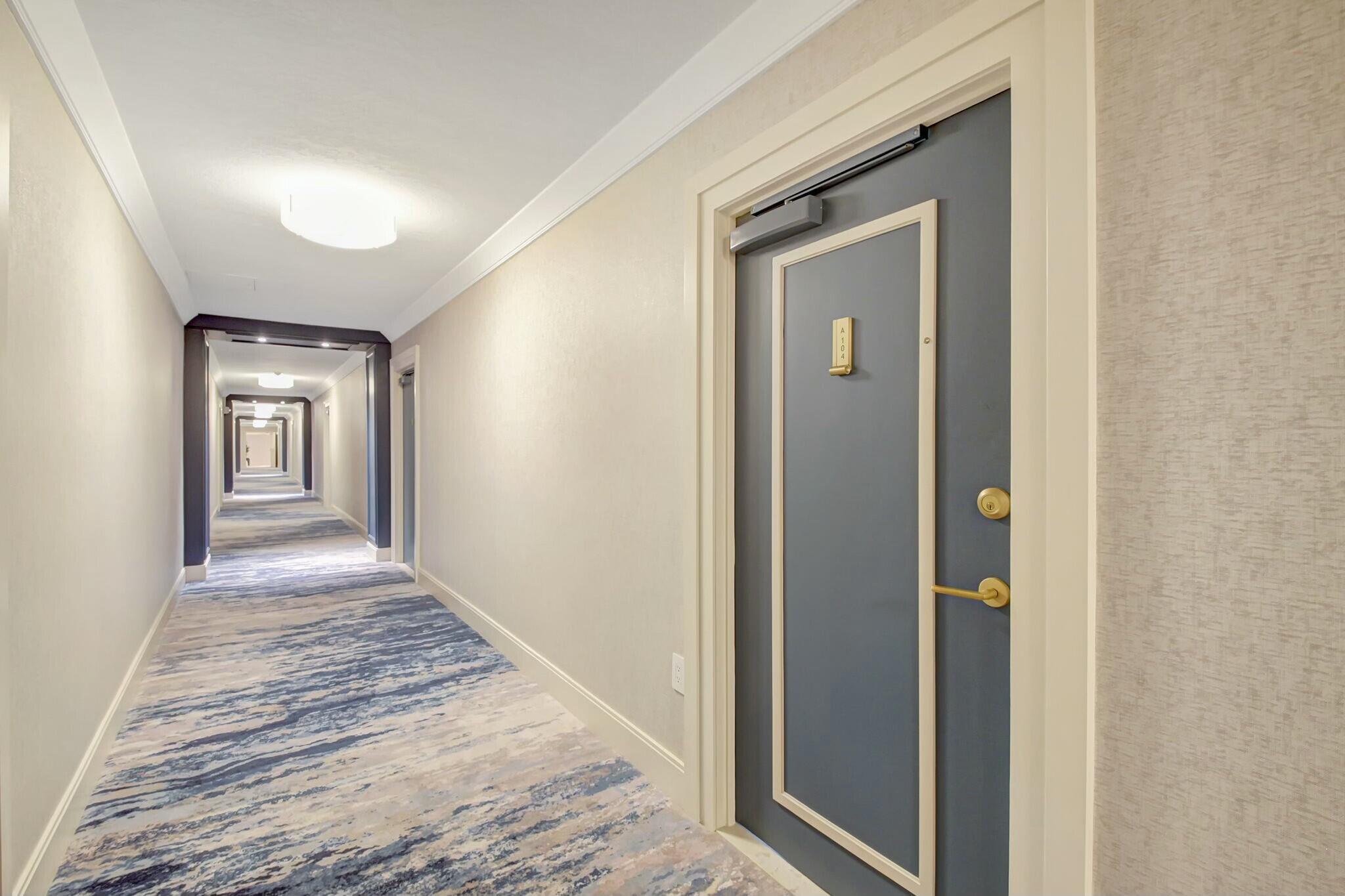 44 Cocoanut Row, Unit 104A Palm Beach, FL 33480 - Photo 18 of 26 a view of a hallway with wooden floor and closet