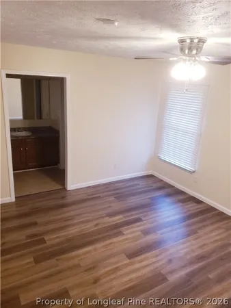 a view of a livingroom with wooden floor