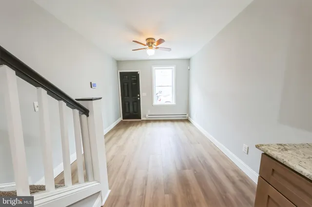 a view of entryway with wooden floor