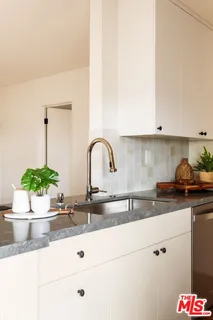 a kitchen with sink and window