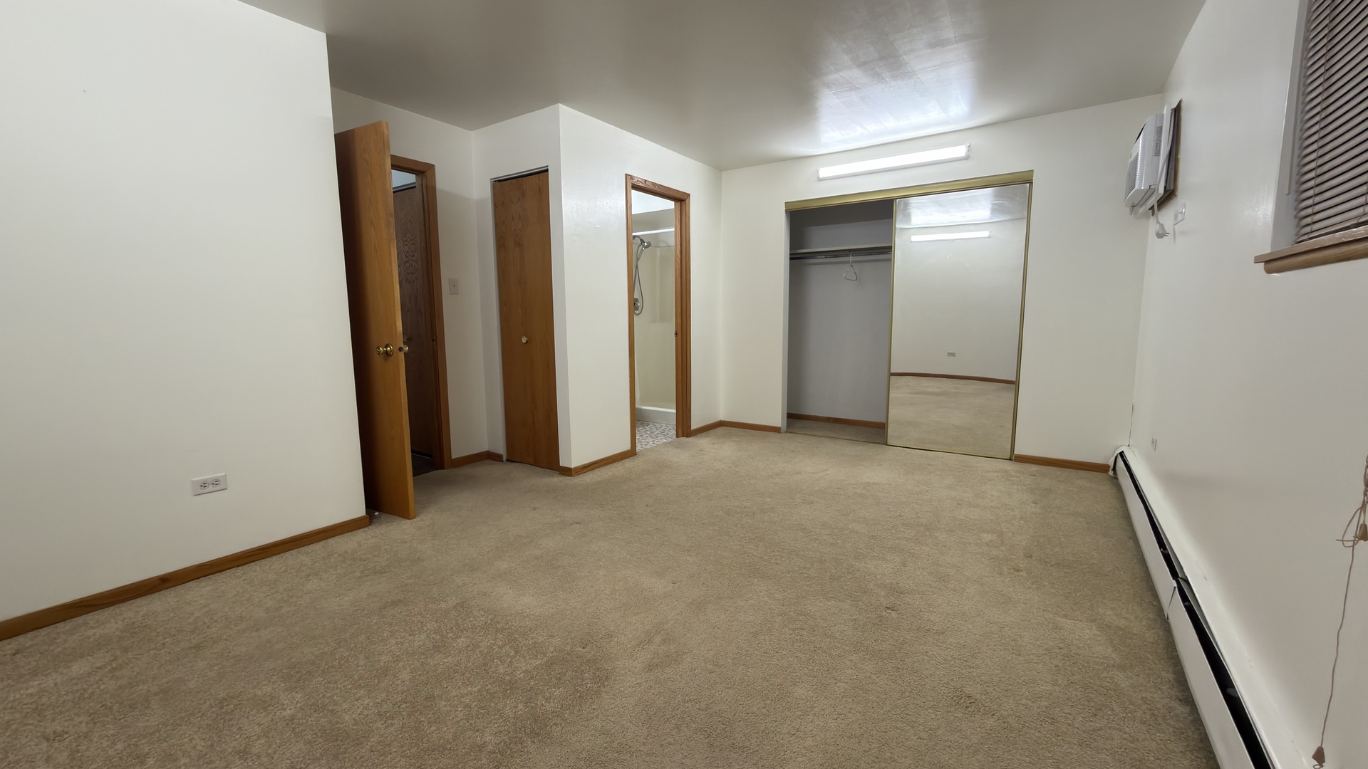 7305 West 157th Street, Unit 3D Orland Park, IL 60462 - Photo 14 of 15 an empty room with closet and mirror