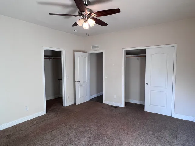 a view of a livingroom with a ceiling fan