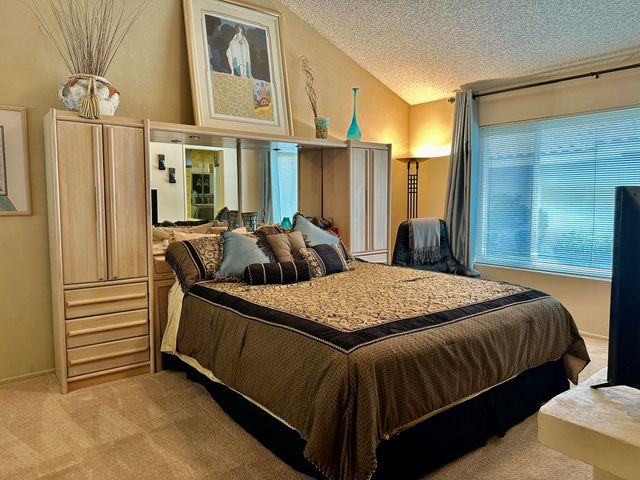 a bedroom with bed and window