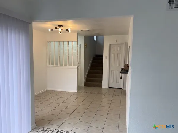 a view of a hallway view with staircase