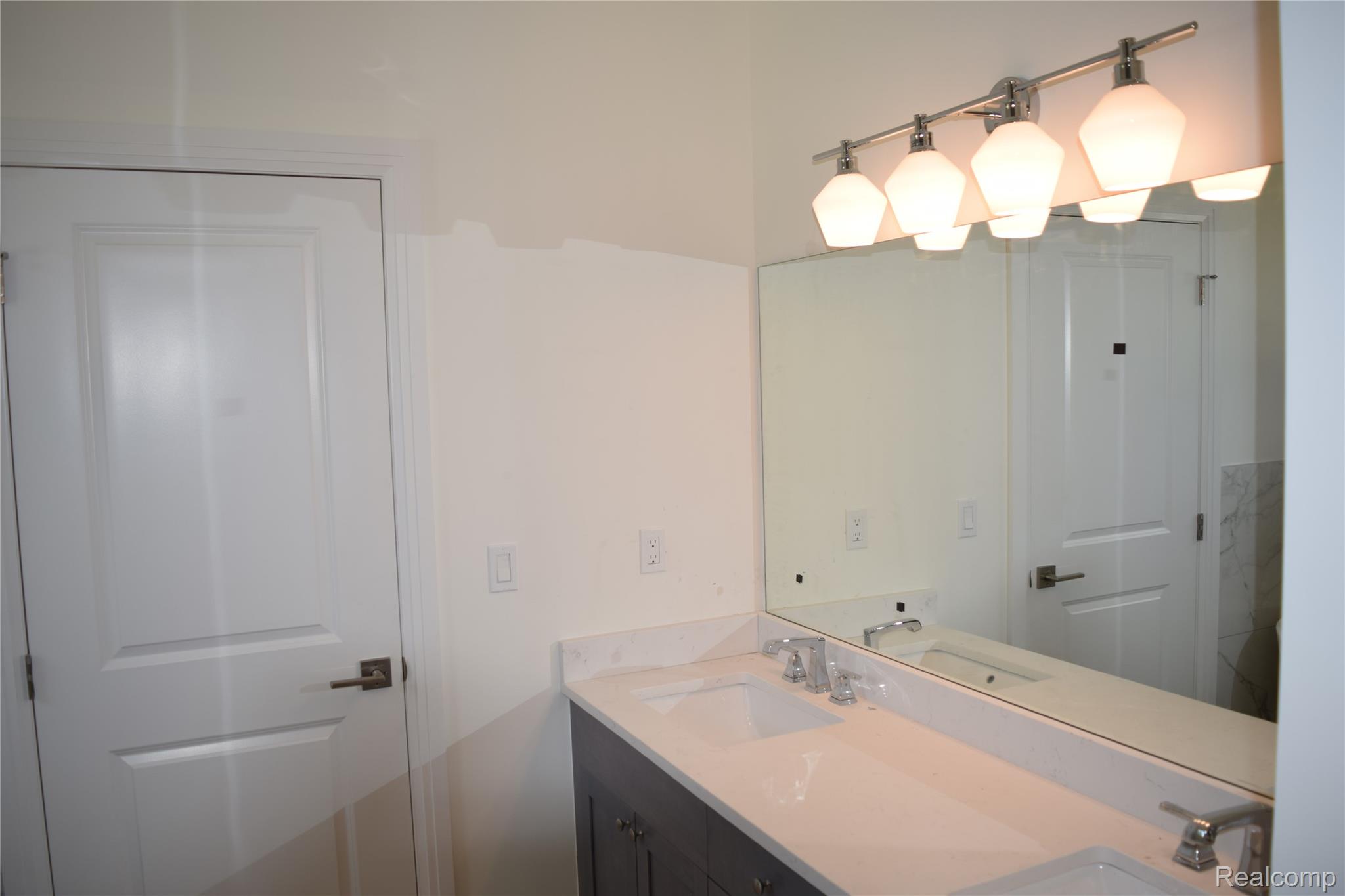 3093 Raffler Drive Rochester, MI 48307 - Photo 28 of 34 Bathroom featuring double vanity