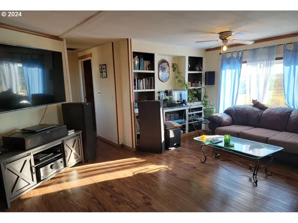 a kitchen with stainless steel appliances granite countertop a refrigerator a sink a stove and island