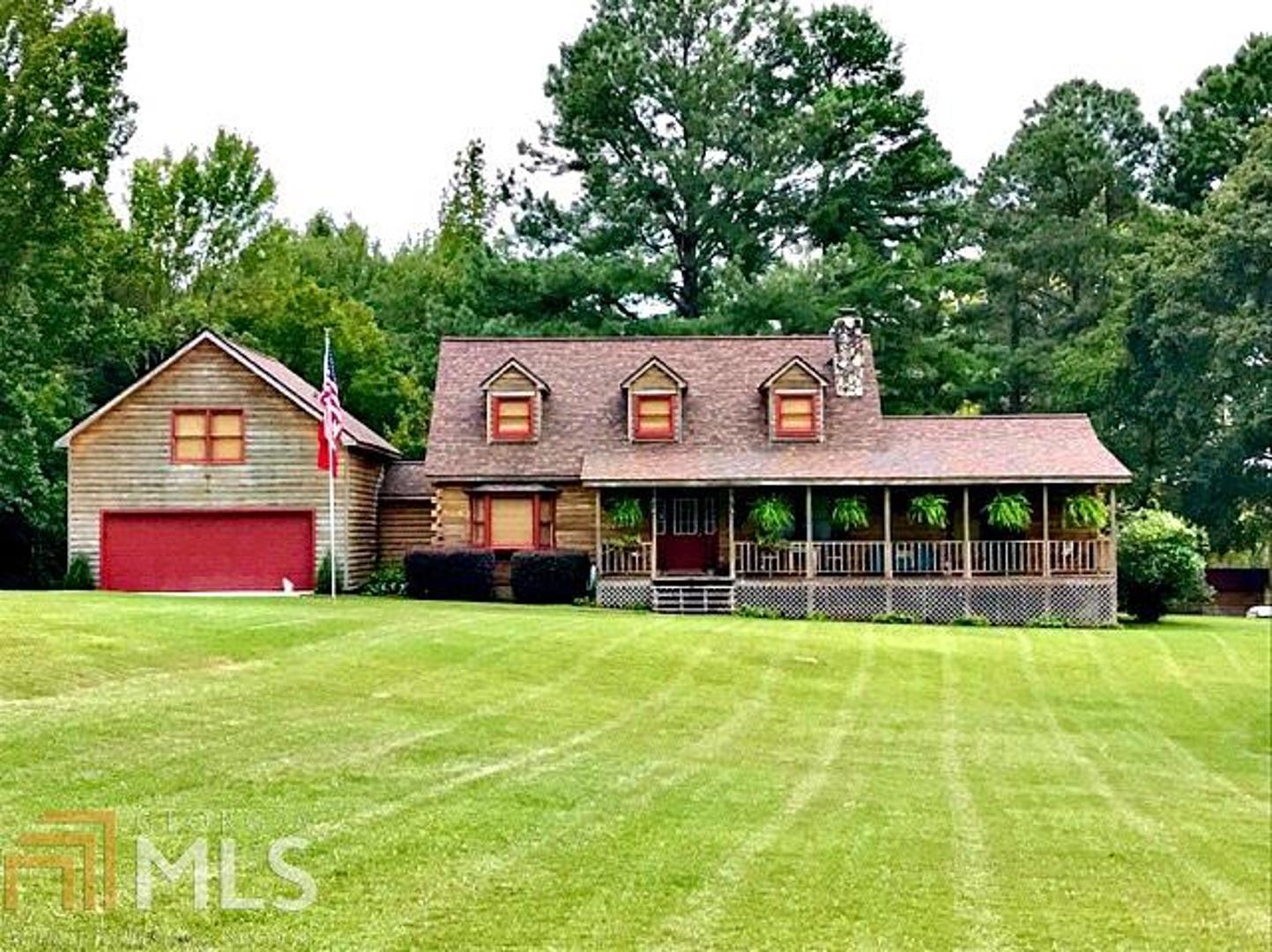 354 Boy Scout Road Newnan, GA 30263 - Photo 1 of 1 a view of a house with a big yard and large trees