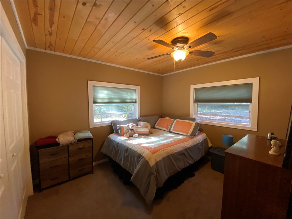 96837 Chester Road Yulee, FL 32097 - Photo 3 of 14 a bedroom with a bed and a chandelier