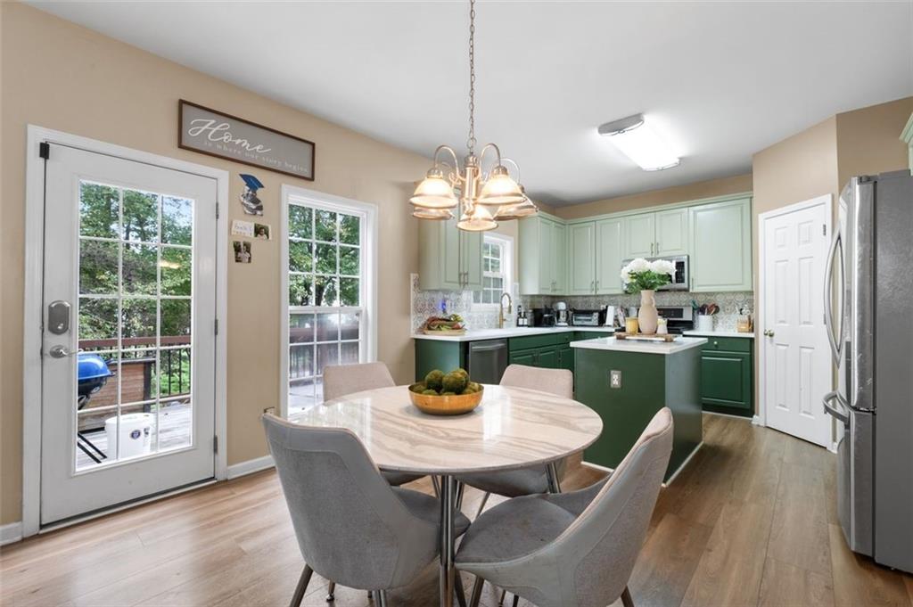 19 Creekside View Hiram, GA 30141 - Photo 14 of 46 a view of a dining room with furniture window and outside view