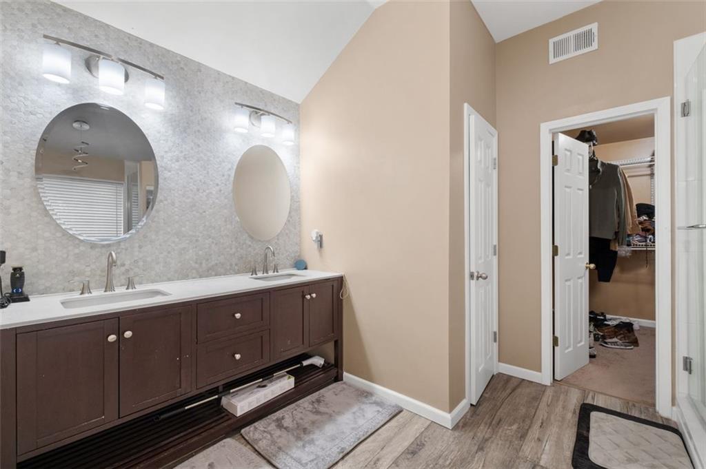 19 Creekside View Hiram, GA 30141 - Photo 22 of 46 a spacious bathroom with a double vanity sink and a mirror
