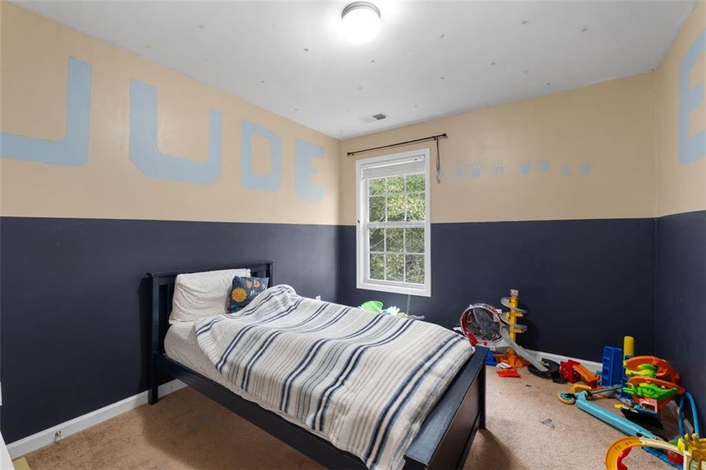 19 Creekside View Hiram, GA 30141 - Photo 28 of 46 a bedroom with a bed and a dresser