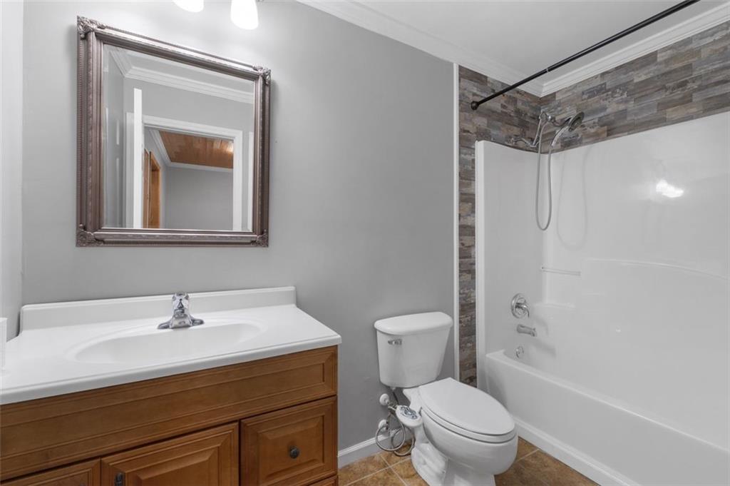 19 Creekside View Hiram, GA 30141 - Photo 34 of 46 a bathroom with a sink toilet and shower