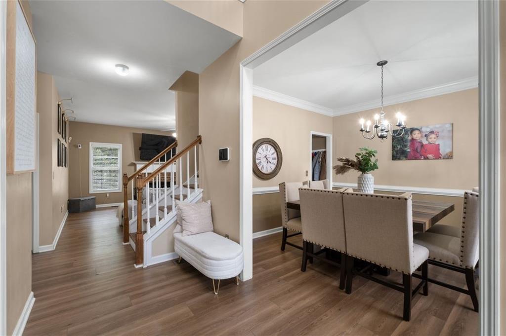 19 Creekside View Hiram, GA 30141 - Photo 6 of 46 a living room with furniture and a chandelier