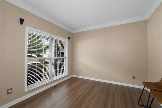 a view of entryway with wooden floor and stairs
