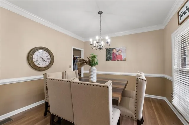 a bathroom with a sink a toilet a mirror and a window