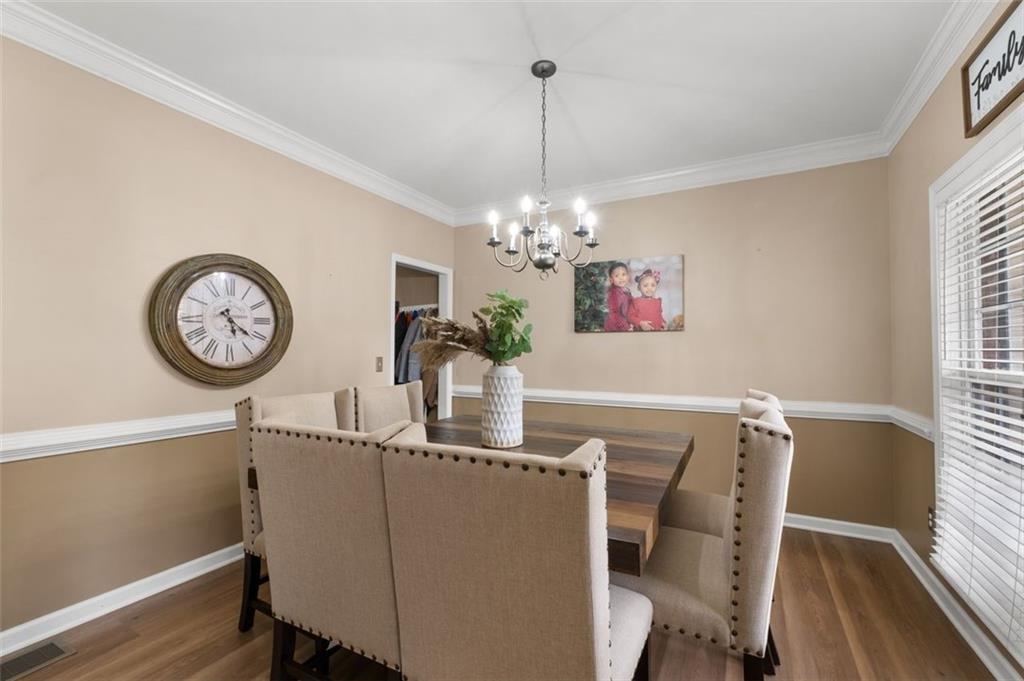 19 Creekside View Hiram, GA 30141 - Photo 9 of 46 a view of a dining room with furniture window and wooden floor
