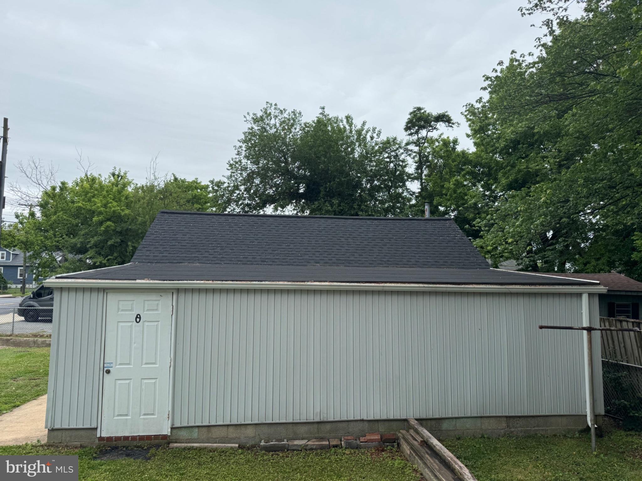 835 Martin Road Baltimore, MD 21221 - Photo 26 of 27 Charming shed with lush greenery backdrop.