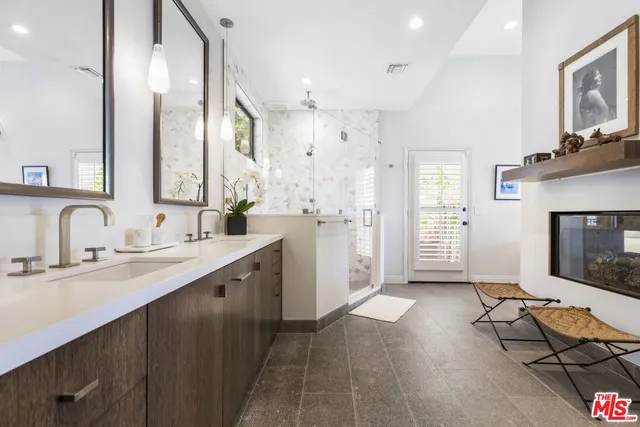 a spacious bathroom with a double vanity sink mirror and