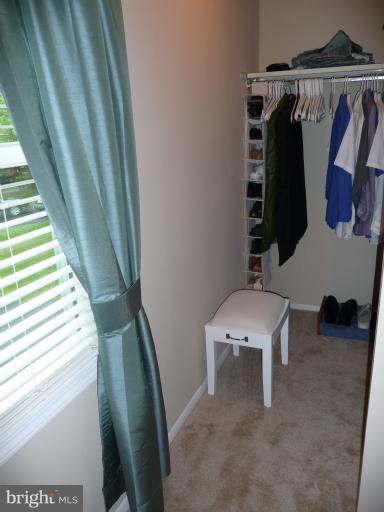 8210 Oakglen Road Manassas, VA 20110 - Photo 21 of 30 Walk-in Closet w/ Natural Light in Master Bedroom