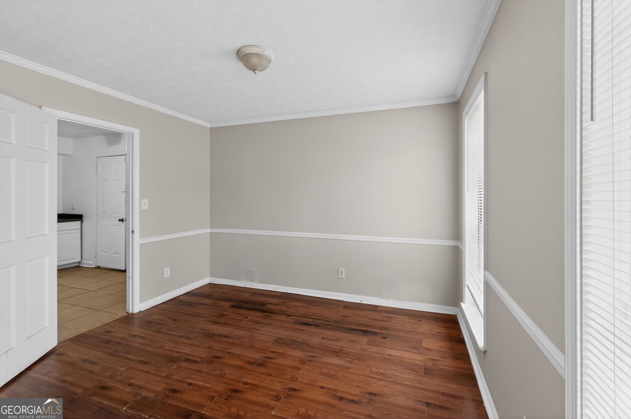 4629 ROUSAY Court Stone Mountain, GA 30083 - Photo 12 of 33 a view of a hallway with wooden floor and a bathroom