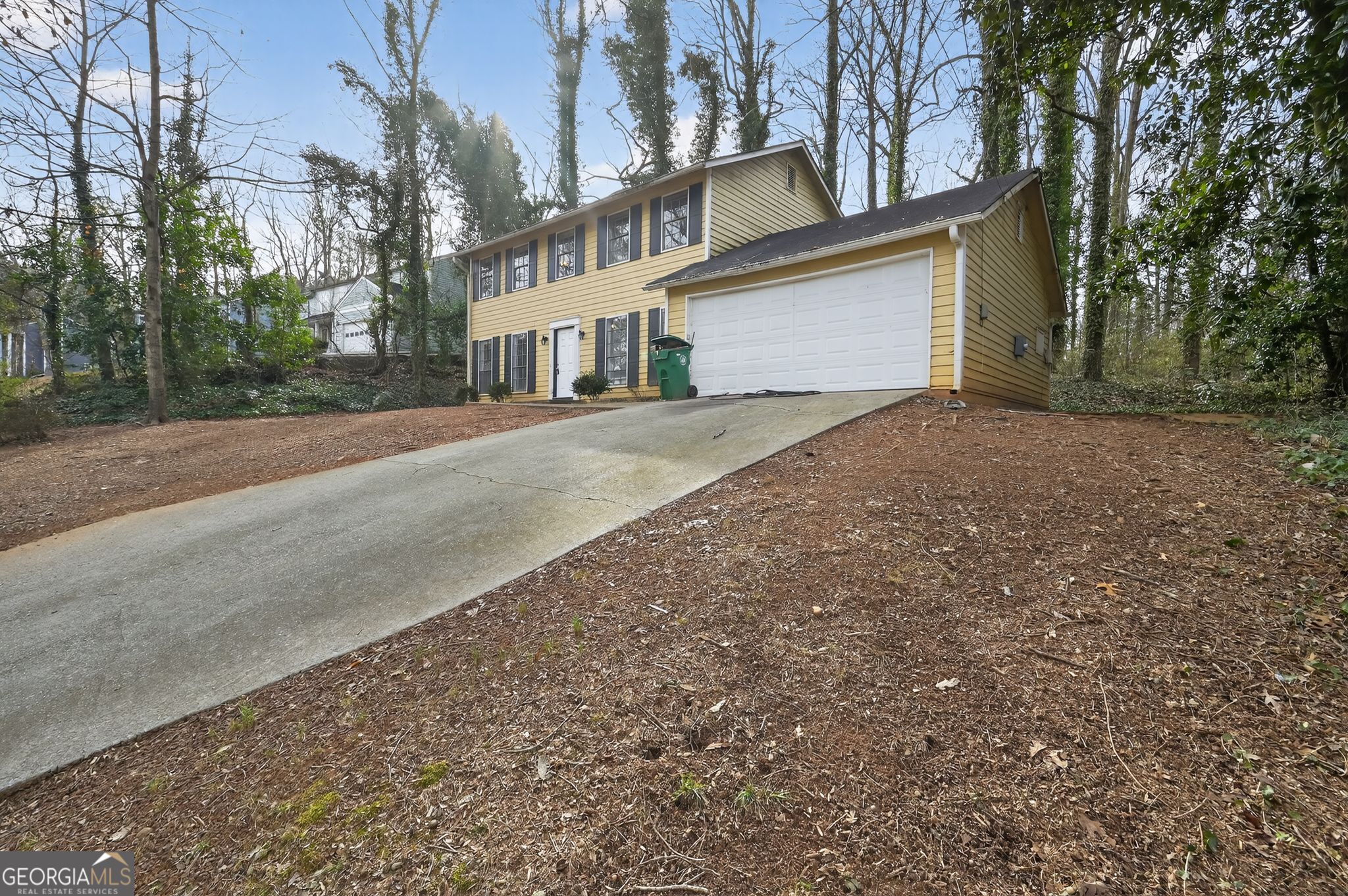 4629 ROUSAY Court Stone Mountain, GA 30083 - Photo 2 of 33 a front view of a house with a yard and garage