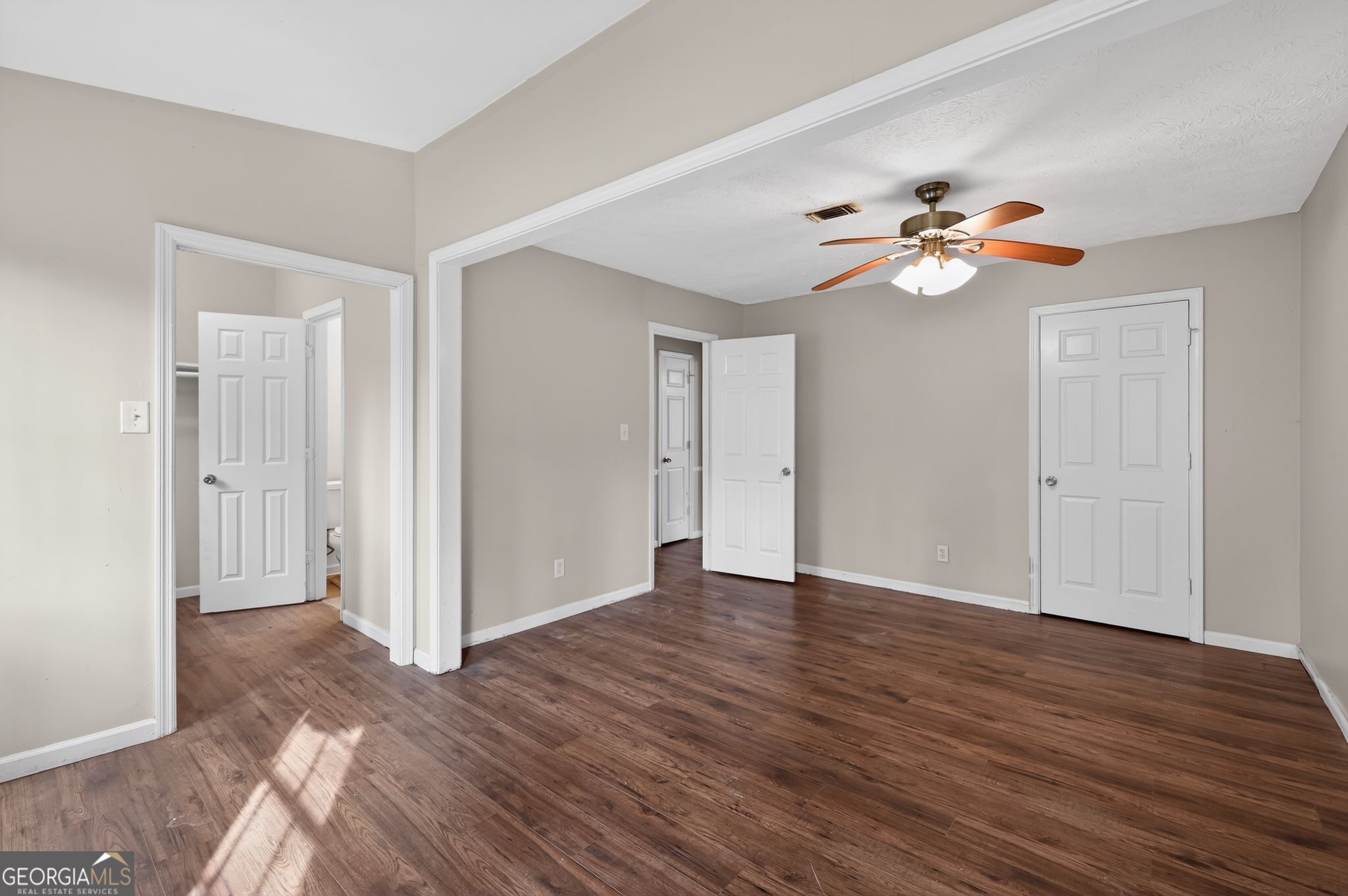 4629 ROUSAY Court Stone Mountain, GA 30083 - Photo 23 of 33 wooden floor in an empty room with a window