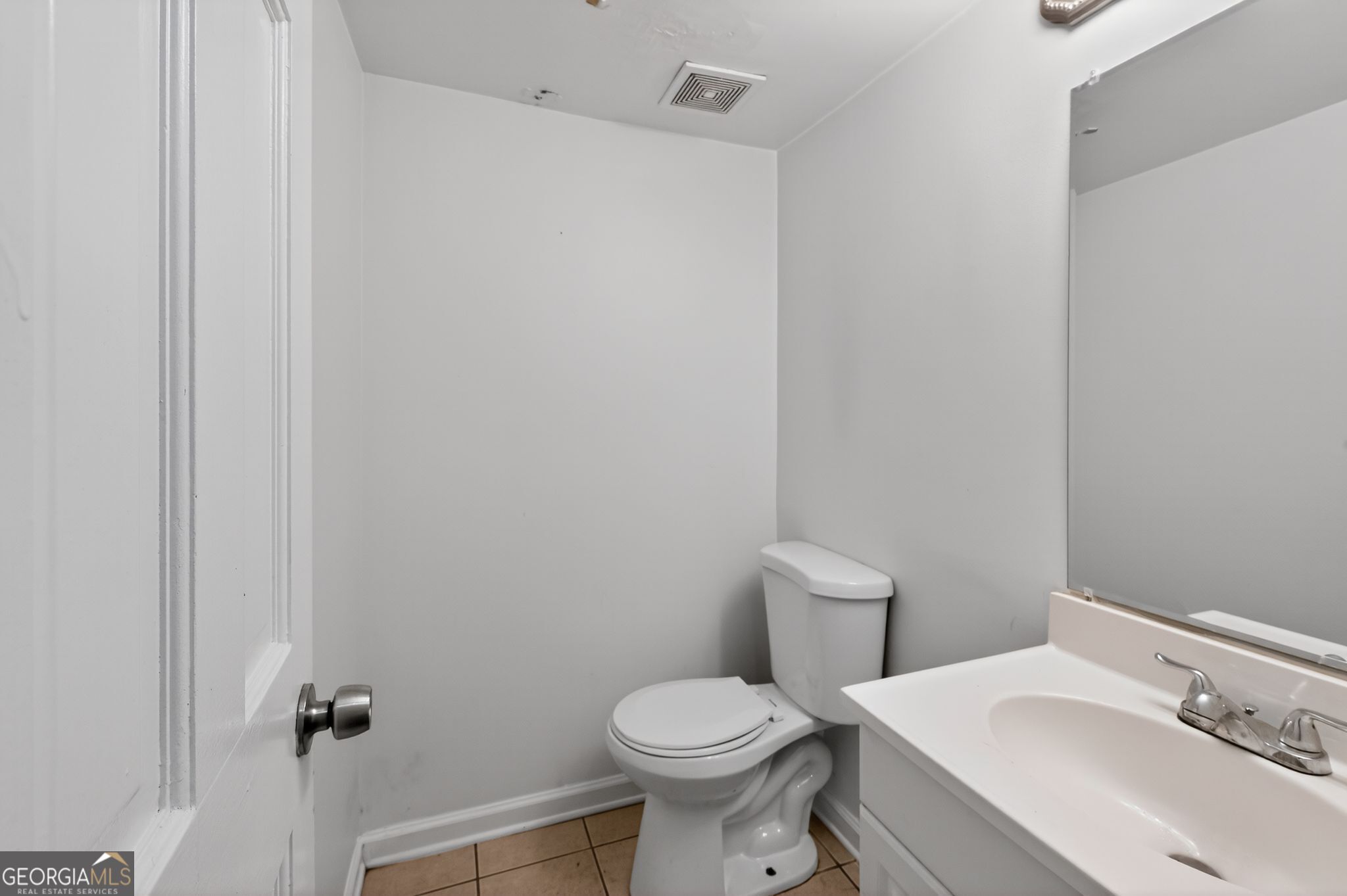 4629 ROUSAY Court Stone Mountain, GA 30083 - Photo 25 of 33 a white toilet sitting next to a bathroom sink