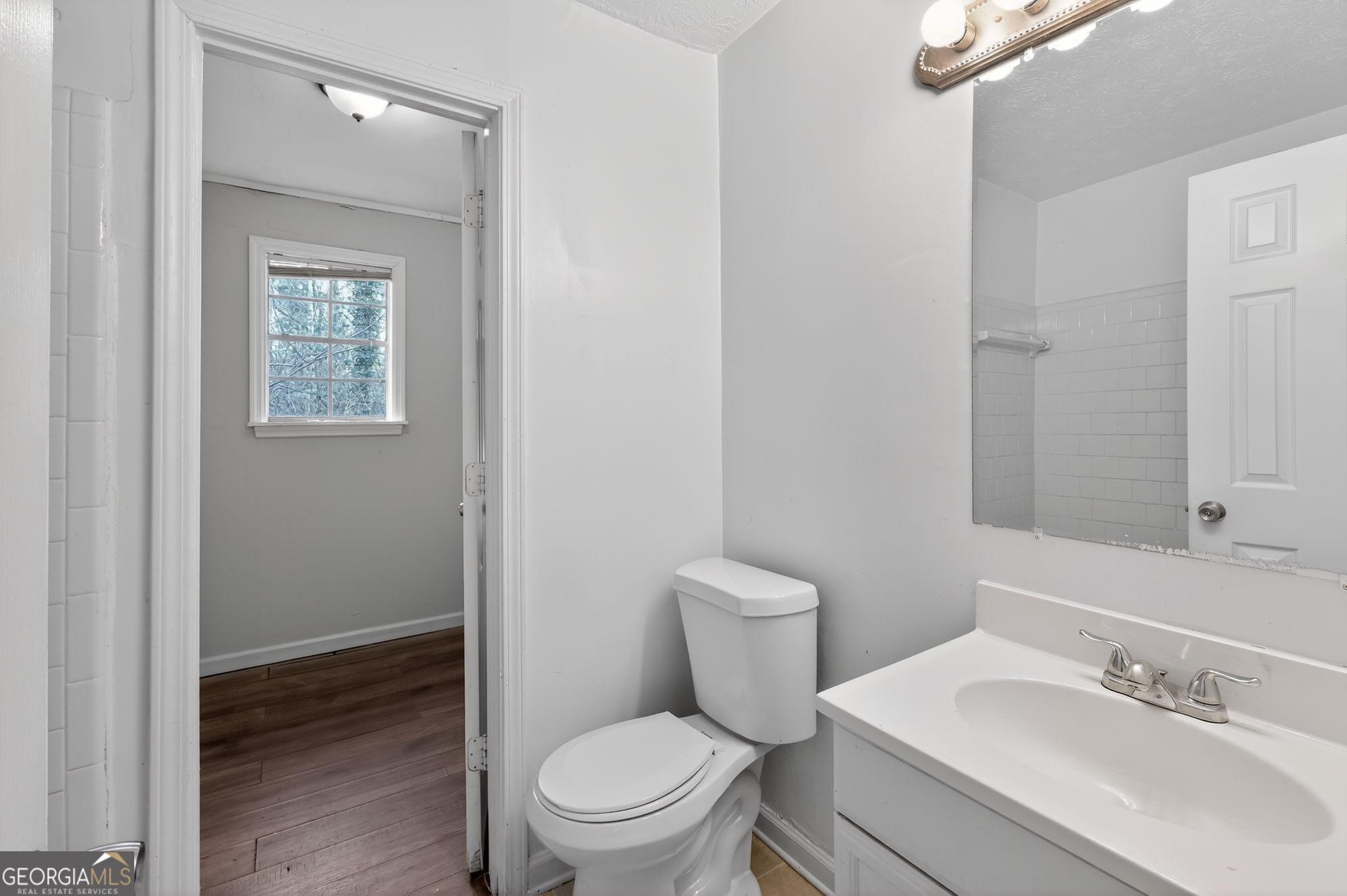 4629 ROUSAY Court Stone Mountain, GA 30083 - Photo 27 of 33 a white toilet sitting next to a bathroom sink