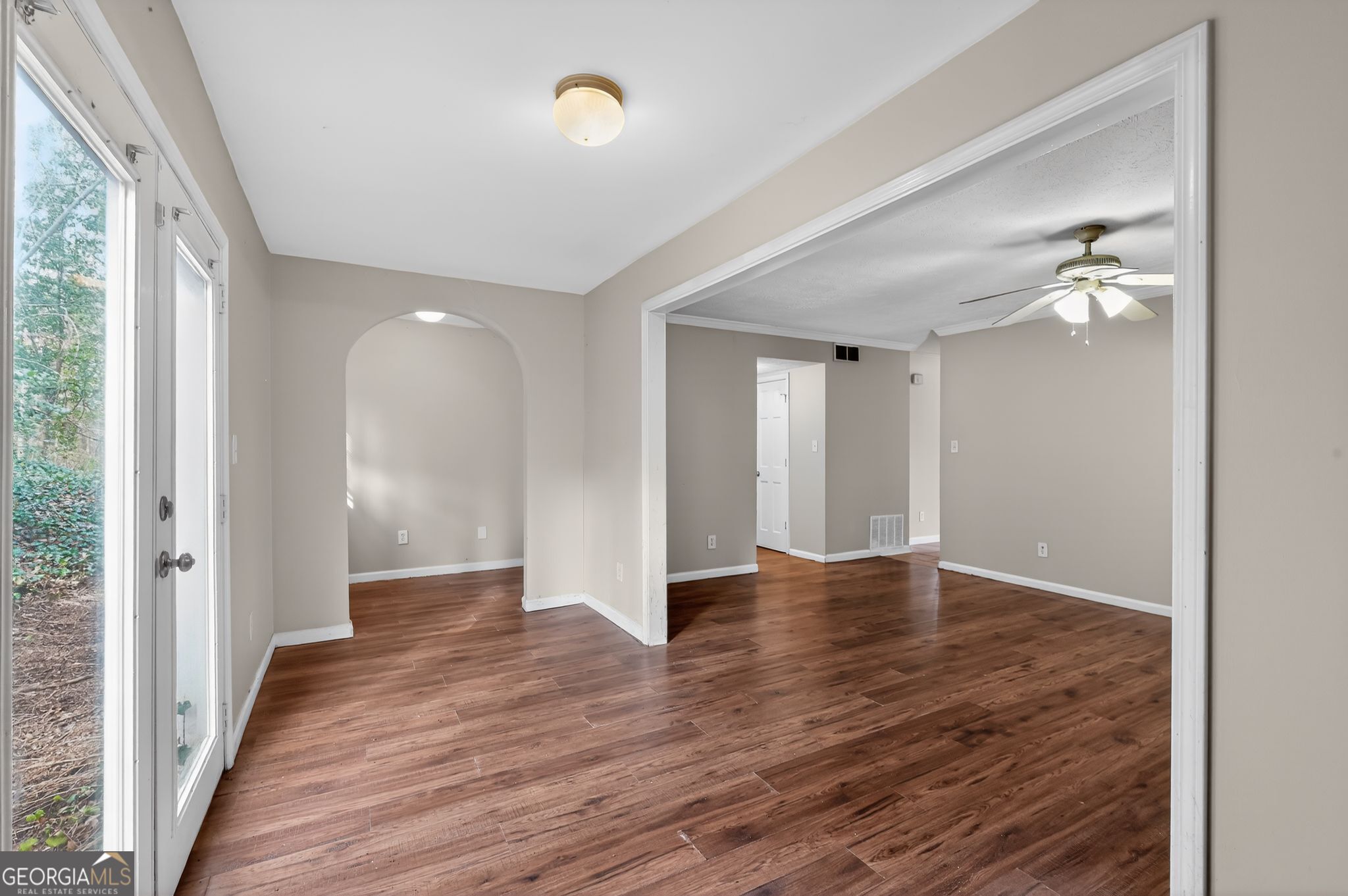 4629 ROUSAY Court Stone Mountain, GA 30083 - Photo 5 of 33 a view of an empty room with wooden floor