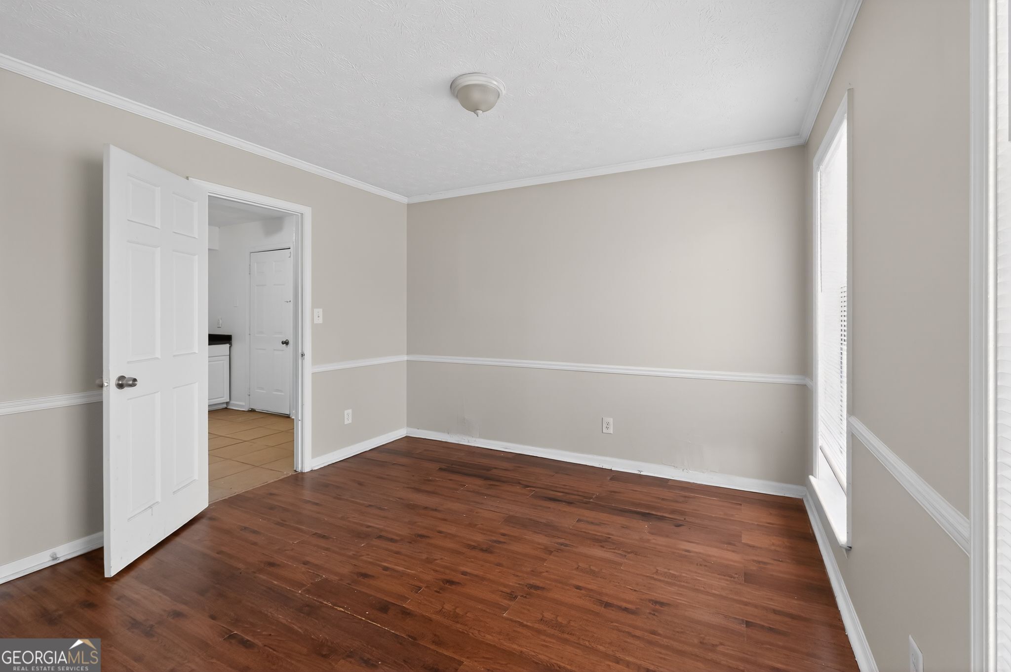 4629 ROUSAY Court Stone Mountain, GA 30083 - Photo 9 of 33 a view of an empty room with wooden floor and closet