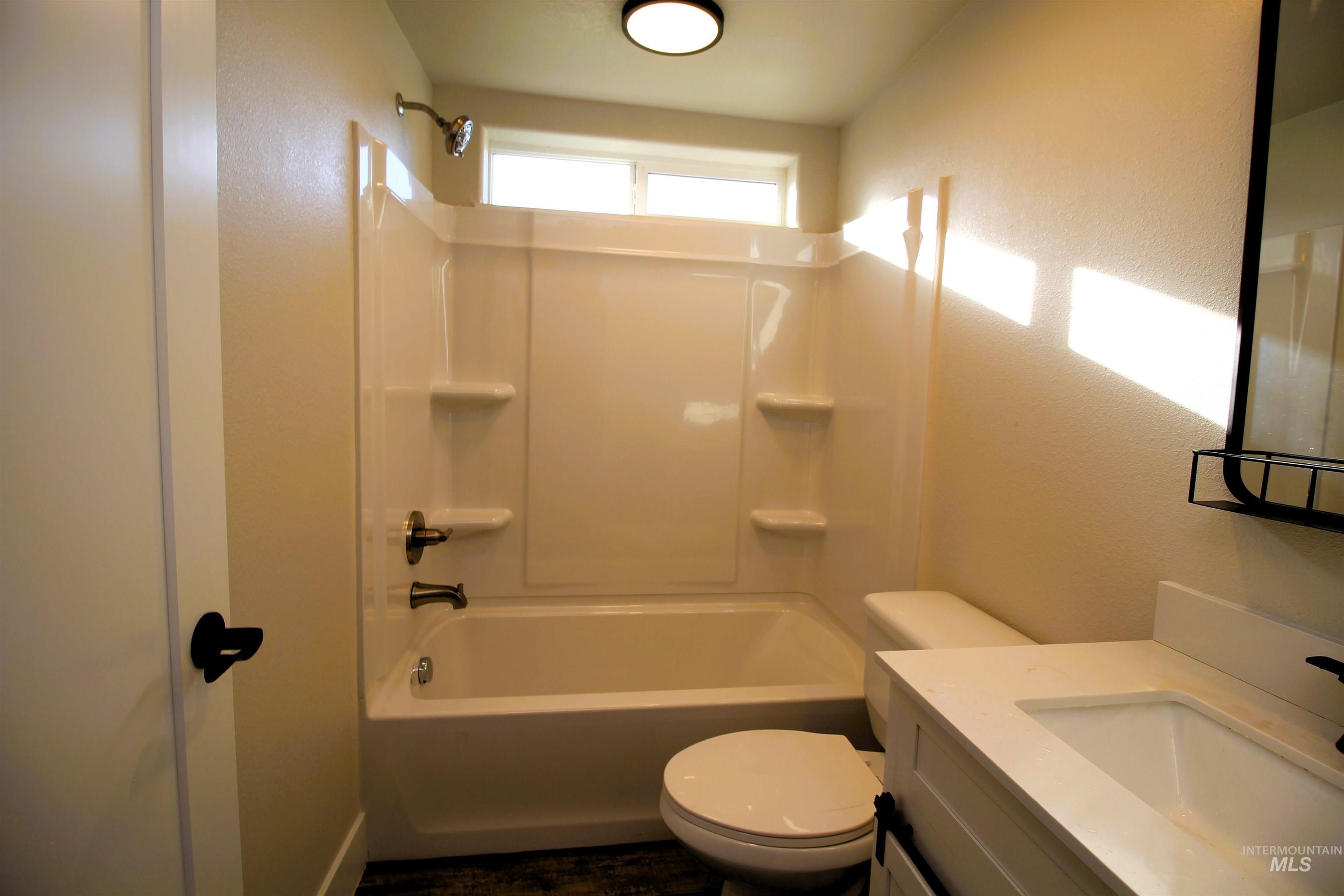 2253 Waite Road Midvale, ID 83645 - Photo 29 of 49 Full bath featuring vanity, shower / tub combination, and a textured wall