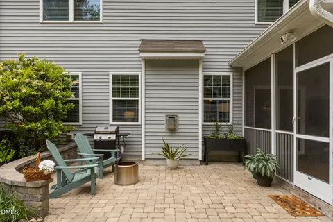 a backyard of a house with outdoor seating